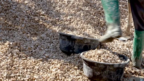 Split stone. construction worker preparing crushed stone for building house. Stock Footage 241913963
