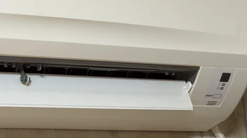 Split System Air Conditioner Shuts Down with a Final Beep and Fading Hum Stock Footage 328917582