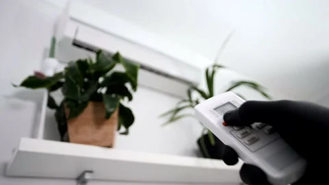 Split system are switched on from the remote control Stock Footage 145479953