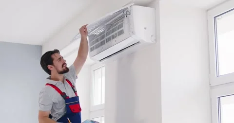 Split system cleaning indoor unit, filters and coils, air flow and temperature Stock Footage 313344819