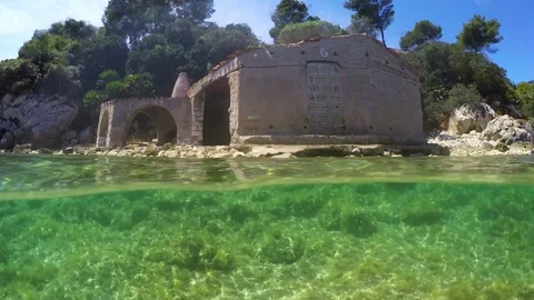 Split underwater view of an abandoned house by the sea Stock Footage 78117747