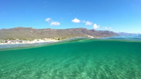 Split underwater view in Alghero turquoise sea. Sardinia, Italy Stock Footage 85646626
