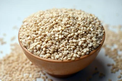 Split Urad Dal in Spoon, Angled Top View Macro Photograph with Soft Defocus.. Stock Photos