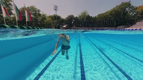 Split View Boy Swimming with Flippers and Mask in Outdoor Pool Stock Footage 342020391