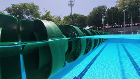 Split View Close Up of Green Lane Divider in Outdoor Swimming Pool Stock Footage 342020652