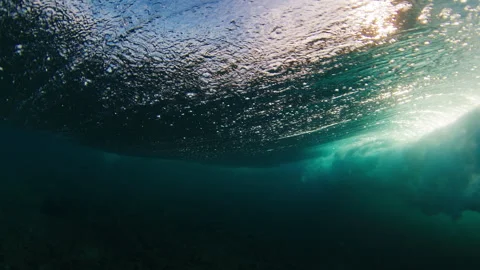 Split view of powerful ocean wave. Wave forms a tube and breaks. Maldives Stock Footage 302539371