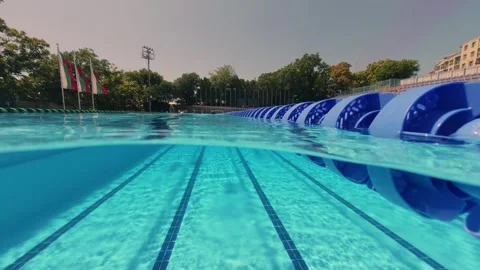 Split View of Swimmer in Outdoor Olympic Swimming Pool Video stock 342019958