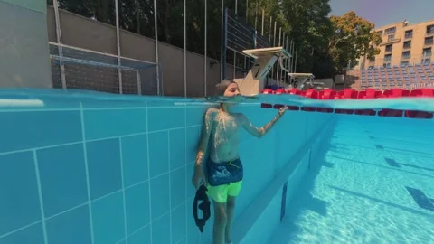 Split View Young Boy in Swimming Cap Standing in Outdoor Pool Stock-Footage 342020246