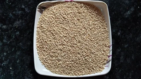 Split white gram lentils (Urad Dal) in a white plate Stock Footage 326021585