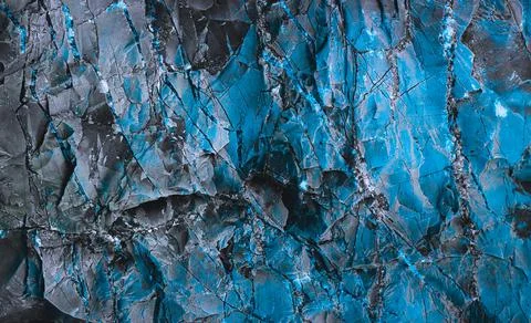 Splits in ice. Cool background. Ice cracks. Rock texture. Ice texture. Rough  Stock Photos