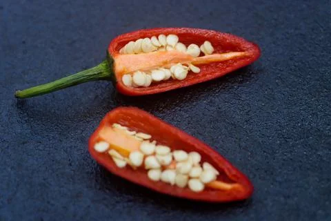 Splitted red chilly Stock Photos