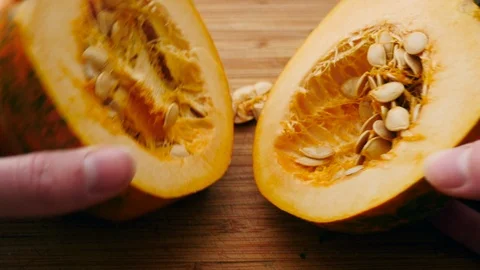 Splitting an Acorn Squash in Half Stock Footage 125829000