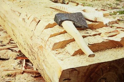 Splitting axe on a tree trunk.Toned image. Stock Photos