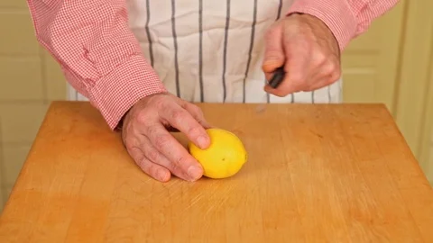Splitting a Lemon on Butcher Block Stock Footage 126655268