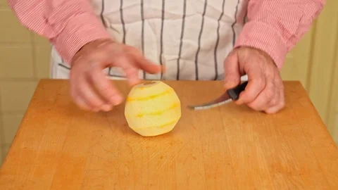 Splitting an Orange on Butcher Block Stock Footage 126655261