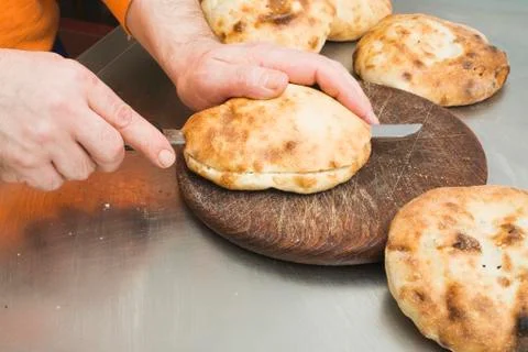 Splitting pita bread Stock Photos