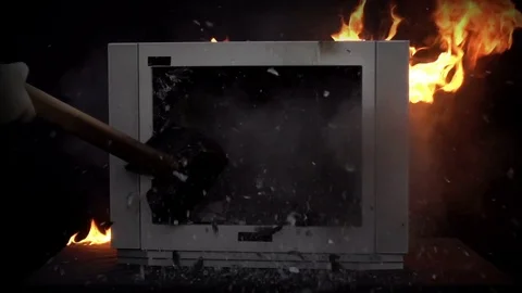 Splitting the TV With a Sledge Hammer Stock Footage 78566426