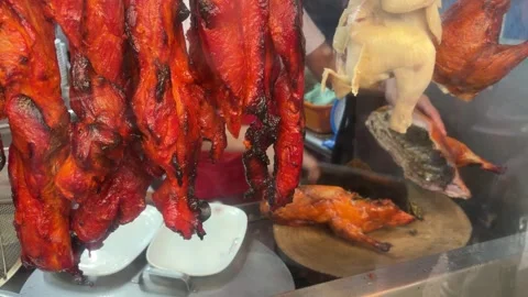 Splitting Whole Roasted Peking Duck Stock Footage 337184782