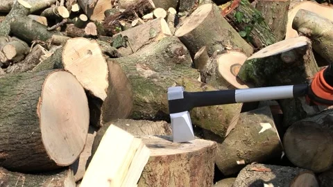 Splitting wood with axe Stock Footage 244262793