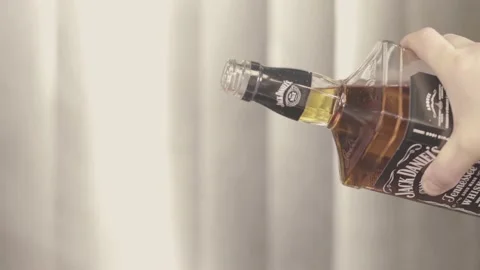 Sploshing whiskey on the griddle Stock Footage 132899847