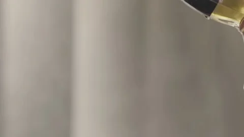 Sploshing whiskey on the griddle Stock Footage 132900053