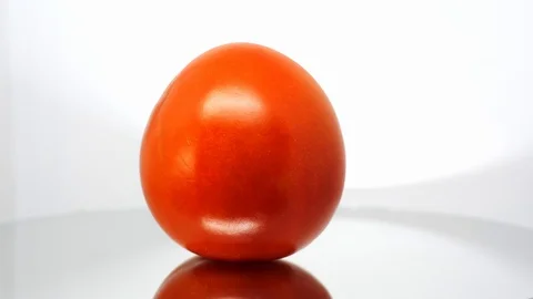 Spoiled tomato close up on white background Видео 104836854