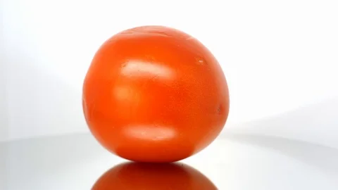 Spoiled tomato close up on white background Stock Footage 104836898