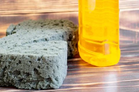 Sponge and detergent on the table Stock Photos