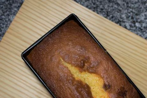 Sponge cake baked in a pan rectangular overhead view with wooden background Stock Photos