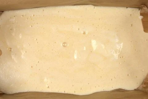 Sponge cake batter in a baking pan full frame texture Stock Photos