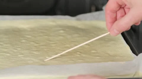 A sponge cake being tested with a wooden stick Video stock 24653119