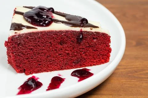 Sponge cake with chocolate and jam. Stock Photos