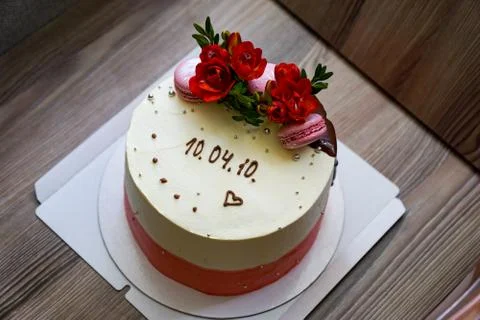 Sponge cake with flowers and biscuits Stock Photos