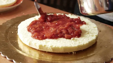 Sponge-cake with fresh strawberries jam Stock Footage 73747267