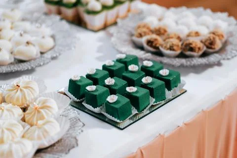Sponge cake with matcha and raspberry filling topped with sour cream. Square  Stock Photos