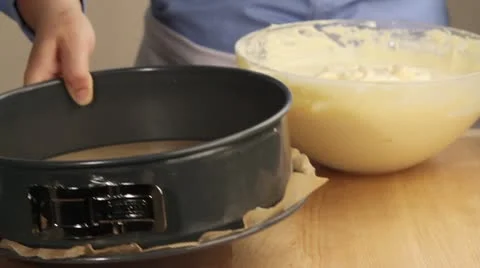 Sponge cake mixture being poured into a springform tin Stock Footage 24671040