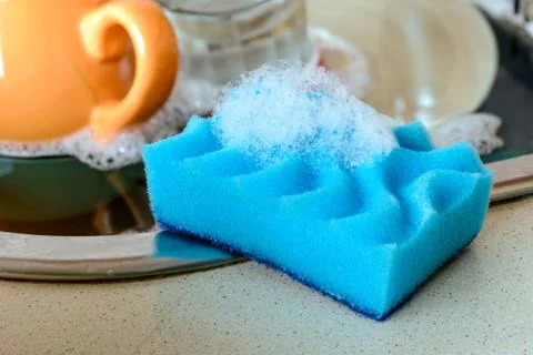 Sponge cleaning dishes 写真素材
