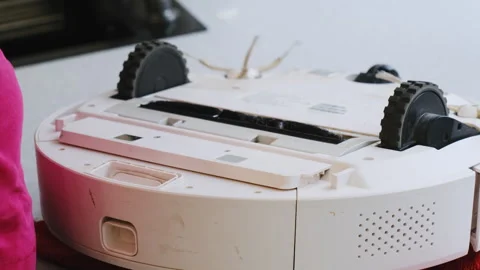 Sponge clears vacuum roller as cleaner removes tangled hair Stock Footage 316173360