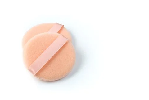Sponge for cosmetics on a white background with space for copying. Stock Photos