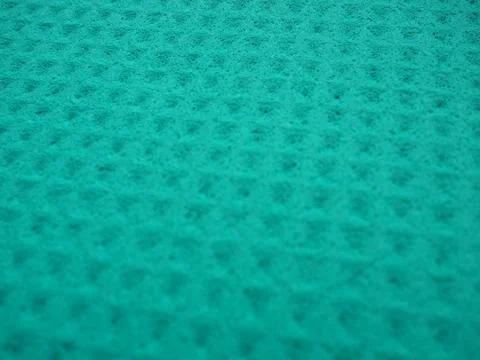 Sponge fibers sponge texture pattern surface close-up green background Foto stock