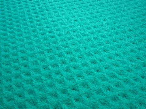 Sponge fibers sponge texture pattern surface close-up green background Foto stock