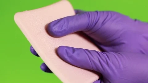 Sponge gloves and green screen Stock Footage 77047445