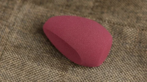 Sponge for makeup. The makeup sponge rotates. sponge for cosmetics Stock Footage 129481338