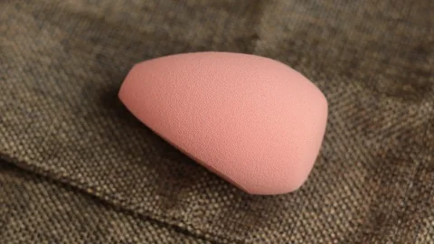 Sponge for makeup. The makeup sponge rotates. sponge for cosmetics Stock Footage 129481340