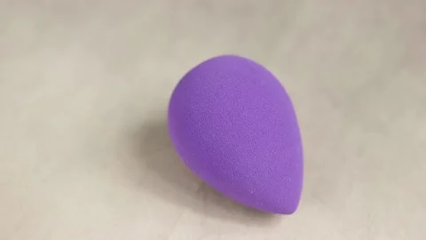 Sponge for makeup - rotates on a beautiful background. Cosmetics, makeup. Stock Footage 130346405