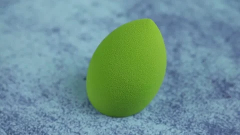 Sponge for makeup - rotates on a beautiful background. Cosmetics, makeup. Stock Footage 130346727