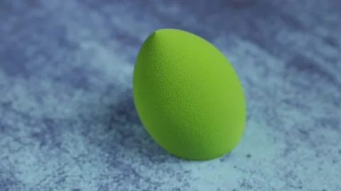 Sponge for makeup - rotates on a beautiful background. Cosmetics, makeup. Stock Footage 130346738