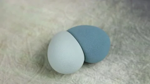 Sponge for makeup - rotates on a beautiful background. Cosmetics, makeup. Stock Footage 130346853