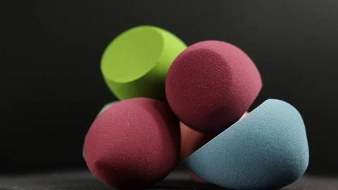 Sponge for makeup. Sponge for makeup on a black background. Stock Footage 129697070