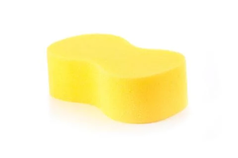 Sponge over white background. Yellow household cleaning sponge. Stock Photos